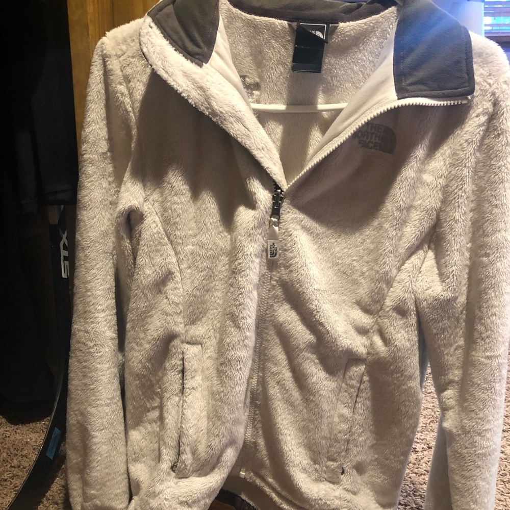 White fuzzy North Face jacket